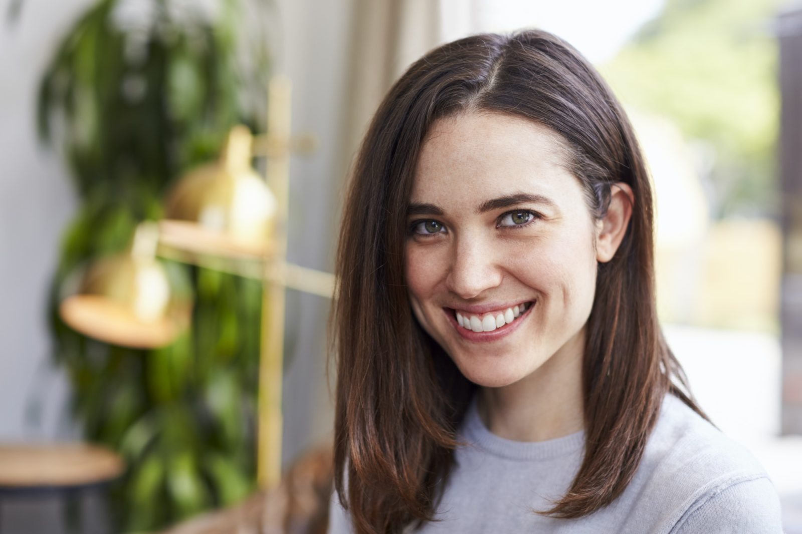 Young smiling white female business owner, portrait