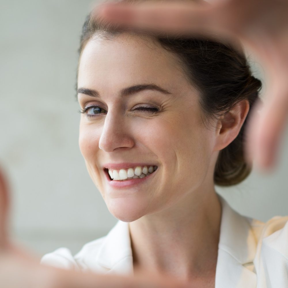 Smiling Woman Making Frame Gesture