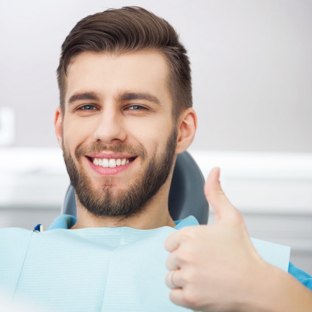 happy patient in dental chair